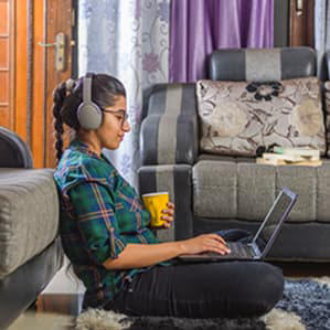 Prospective student using her laptop at home